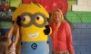Mrs. Rossa poses with one of the minions.