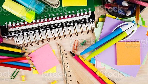 School and office accessories on wooden background